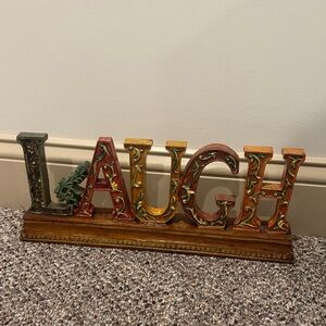 Colorful Decorative 'LAUGH' Sign